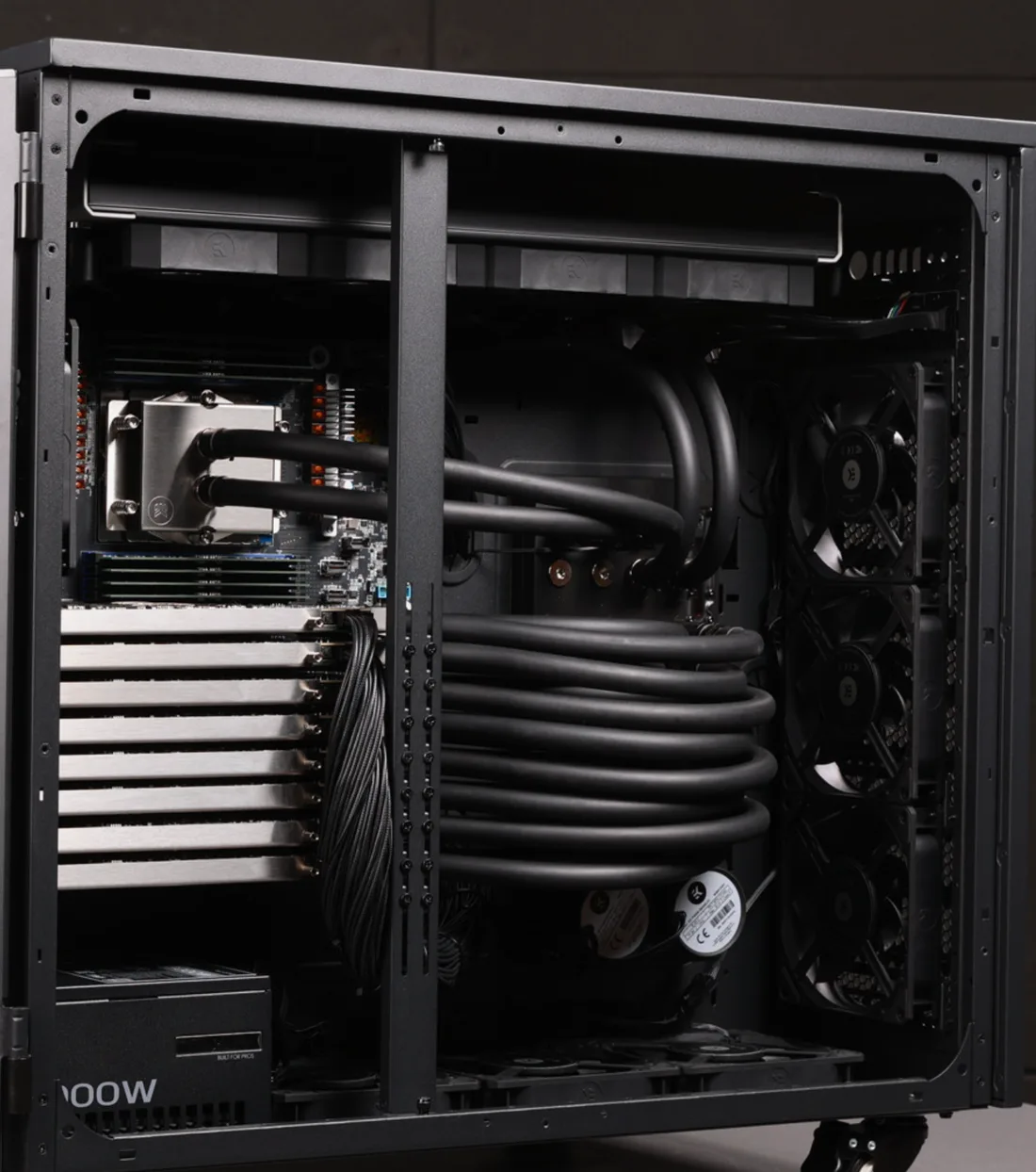 Inside the reference build: radiator fans along the chassis wall and the coolant loop running to the CPU and GPU water blocks